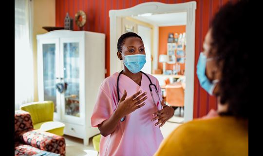 nurse and patient in home