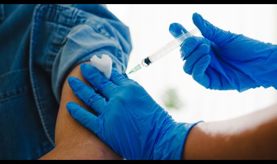 Male patient receiving vaccination