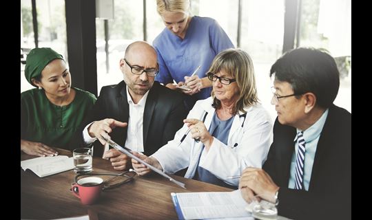 Group of associates and physicians talking