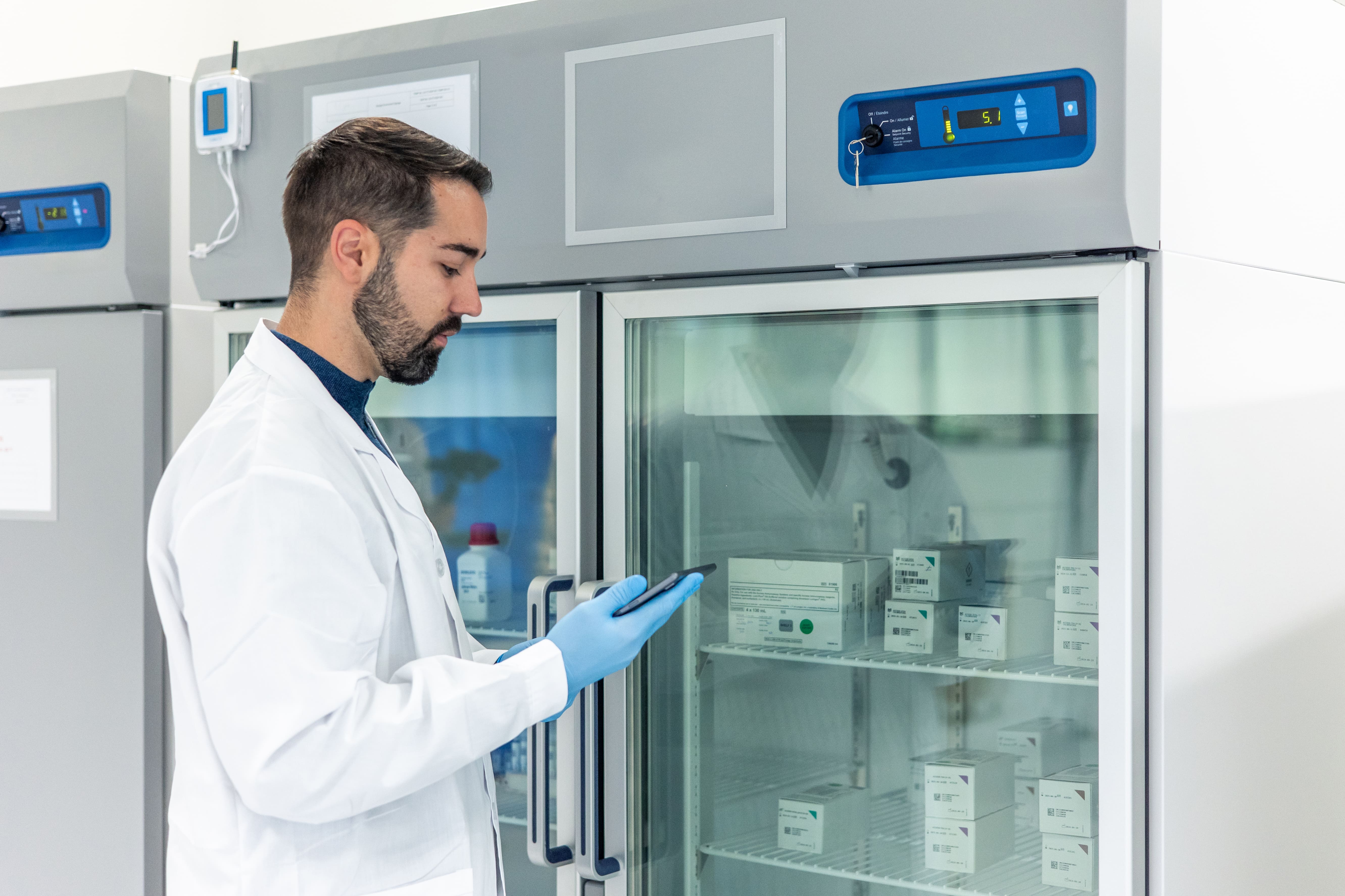 Scientist examines therapy from a clinical trial